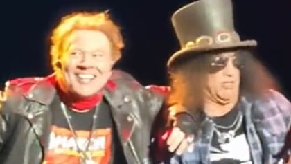 Watch: SLASH Accidentally Bumps Into AXL ROSE During GUNS N' ROSES Concert In Brazil